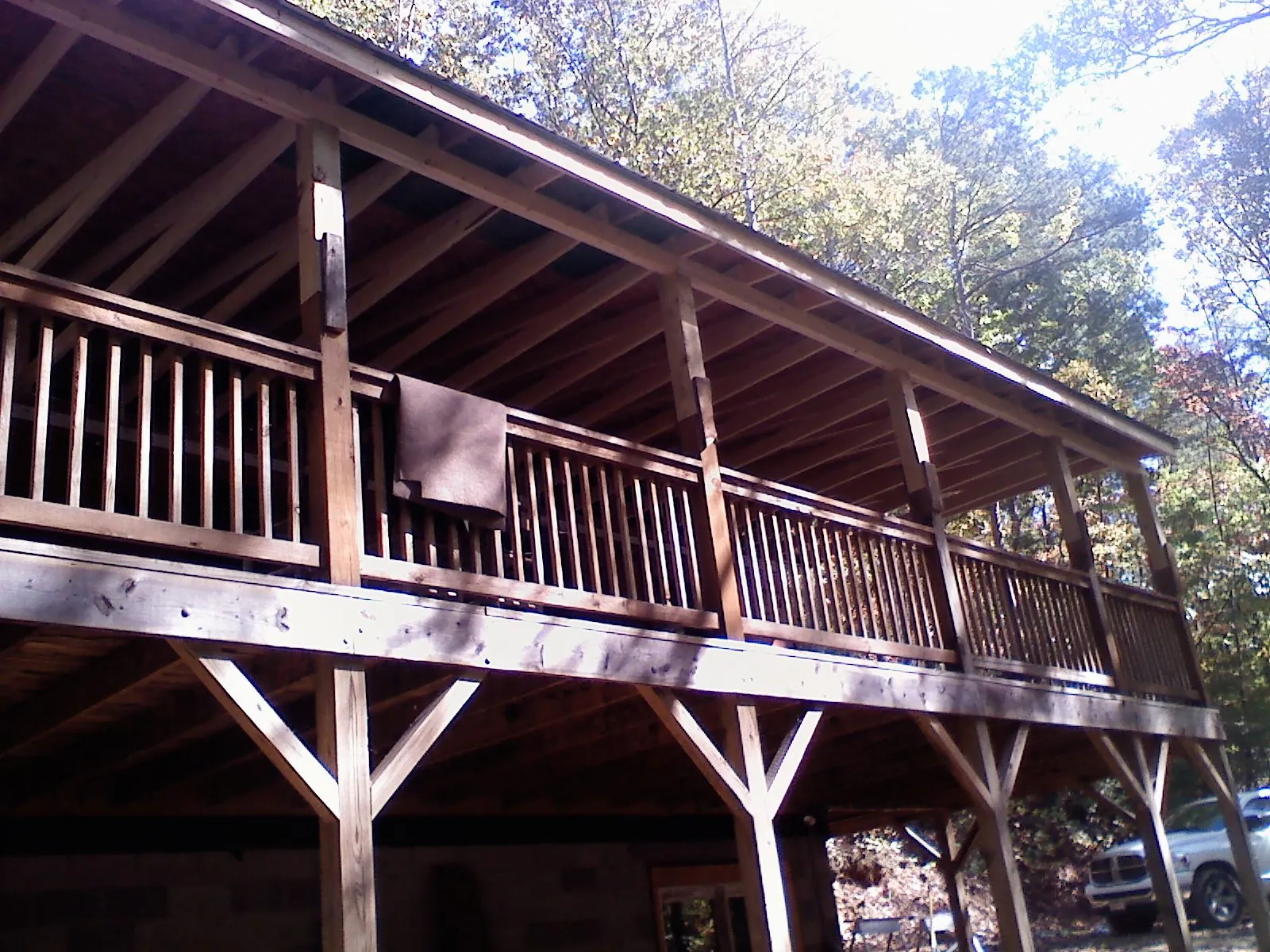 Timber framing under a new elevated porch and deck — Roof Leak Repair in Waterport by Roofing Brothers